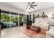 Living room with white couches, and access to backyard pool at 15320 W Baden St, Goodyear, AZ 85338