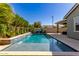 Luxury pool with a waterfall and basketball hoop at 15320 W Baden St, Goodyear, AZ 85338