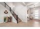 Modern staircase with metal railing and decorative wall art at 15320 W Baden St, Goodyear, AZ 85338