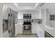 Modern white kitchen with stainless steel appliances at 1601 W Sunnyside Dr # 157, Phoenix, AZ 85029