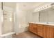Double vanity bathroom with a soaking tub and shower at 16958 W Marconi Ave, Surprise, AZ 85388