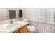 Clean bathroom with single sink vanity, toilet, and shower/tub at 16958 W Marconi Ave, Surprise, AZ 85388