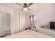 Bedroom with full-size bed, desk, and plenty of natural light at 16958 W Marconi Ave, Surprise, AZ 85388