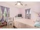 Bedroom with full-size bed, desk, and plenty of natural light at 16958 W Marconi Ave, Surprise, AZ 85388
