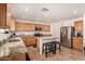 Modern kitchen with granite counters and stainless steel appliances at 16958 W Marconi Ave, Surprise, AZ 85388