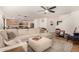 Open concept living room with a sectional sofa and kitchen views at 16958 W Marconi Ave, Surprise, AZ 85388