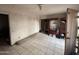 Living room with tiled floors and built-in shelving at 1725 W Hadley W St, Phoenix, AZ 85007