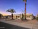 Front view of a single-story house with a landscaped yard at 20210 N 124Th Dr, Sun City West, AZ 85375