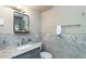 Updated bathroom with marble tile, vanity with vessel sink, and a shower at 2025 W Wood Dr, Phoenix, AZ 85029