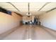 Spacious garage with ample storage and overhead shelving at 20716 N Shadow Mountain Dr, Surprise, AZ 85374