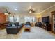 Spacious living room with leather furniture and ceiling fan at 20716 N Shadow Mountain Dr, Surprise, AZ 85374