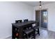 Dark wood dining table with four chairs near sliding door to balcony at 2220 W Dora St # 215, Mesa, AZ 85201