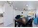 Open concept dining area with table and kitchen view at 2220 W Dora St # 215, Mesa, AZ 85201