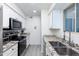Clean and bright kitchen with stainless steel appliances at 2220 W Dora St # 215, Mesa, AZ 85201