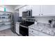 Modern kitchen with stainless steel appliances and granite counters at 2220 W Dora St # 215, Mesa, AZ 85201