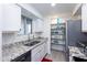 Modern kitchen with stainless steel appliances and granite counters at 2220 W Dora St # 215, Mesa, AZ 85201