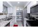 Modern kitchen featuring stainless steel appliances and granite countertops at 2220 W Dora St # 215, Mesa, AZ 85201
