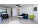 Bright and airy living room with wood-look floors and a dining area at 2220 W Dora St # 215, Mesa, AZ 85201