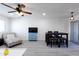 Bright living room featuring a comfy chaise lounge, dining table, and TV at 2220 W Dora St # 215, Mesa, AZ 85201