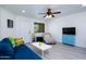 Living room with wood-look floors, blue sofa, and a chaise lounge at 2220 W Dora St # 215, Mesa, AZ 85201