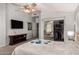 Main bedroom with mirrored closet doors and TV at 2224 E Crest Ln, Phoenix, AZ 85024