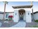 Elegant entryway with a stone facade and a grand arched doorway at 23886 N 81St Dr, Peoria, AZ 85383