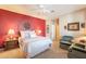 Guest bedroom with red accent wall and ceiling fan at 2472 E Vermont Dr, Gilbert, AZ 85295