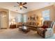 Relaxing living room with comfortable seating and a ceiling fan at 2472 E Vermont Dr, Gilbert, AZ 85295