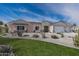 Beautiful desert home with a welcoming front yard and attached garage at 27016 N 153Rd Dr, Surprise, AZ 85387