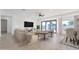 Bright and airy living room with sliding glass doors and a dining area at 27016 N 153Rd Dr, Surprise, AZ 85387