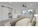 Bright bedroom with large windows and ensuite bathroom at 27035 N 153Rd Dr, Surprise, AZ 85387