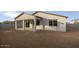 Exterior view of a home featuring covered patio, a concrete slab, and a dirt backyard at 2937 E Lawndale Ct, Gilbert, AZ 85298