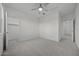 Bedroom with neutral carpet, white walls, two closets, and ceiling fan at 2937 E Lawndale Ct, Gilbert, AZ 85298