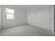 Bright bedroom featuring carpet flooring, white walls, and a window with a view at 2937 E Lawndale Ct, Gilbert, AZ 85298