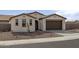 Charming single-story home showcasing a two car garage and low maintenance desert landscaping at 2937 E Lawndale Ct, Gilbert, AZ 85298