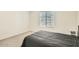 Simple bedroom with double bed and small nightstand at 29460 N 123Rd Gln, Peoria, AZ 85383