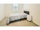 Bright bedroom with a double bed and nightstand at 29460 N 123Rd Gln, Peoria, AZ 85383