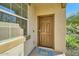 Front entrance with brown door and welcoming doormat at 29460 N 123Rd Gln, Peoria, AZ 85383