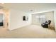 Spacious living area with a large TV and recliner at 29460 N 123Rd Gln, Peoria, AZ 85383