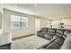 Open floor plan living room with kitchen view at 29460 N 123Rd Gln, Peoria, AZ 85383