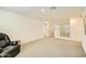 Open loft area, carpeted, with a view of the staircase at 29460 N 123Rd Gln, Peoria, AZ 85383