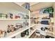 Well-stocked walk-in pantry with ample shelving at 29460 N 123Rd Gln, Peoria, AZ 85383