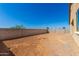 Large backyard with block wall and desert landscaping at 31550 N Hayweather Ln, San Tan Valley, AZ 85143