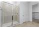Clean bathroom with a large glass shower and access to a closet at 31550 N Hayweather Ln, San Tan Valley, AZ 85143