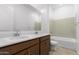 Double vanity bathroom with a bathtub and shower at 31550 N Hayweather Ln, San Tan Valley, AZ 85143