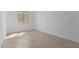 Bright bedroom with tile flooring and large window at 31550 N Hayweather Ln, San Tan Valley, AZ 85143