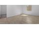 Bright bedroom with tile flooring and access to another room at 31550 N Hayweather Ln, San Tan Valley, AZ 85143