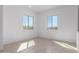Spacious bedroom featuring tile floors and large windows at 31550 N Hayweather Ln, San Tan Valley, AZ 85143