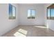 Bright bedroom with tile flooring and multiple windows at 31550 N Hayweather Ln, San Tan Valley, AZ 85143