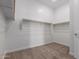 Large walk-in closet with double hanging rods at 31550 N Hayweather Ln, San Tan Valley, AZ 85143